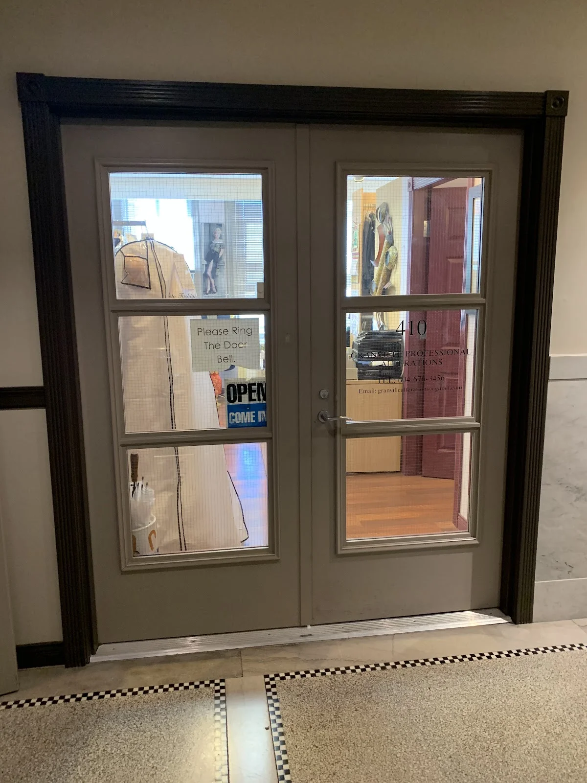 Alteration shop interior with garments ready for pickup